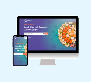 A computer monitor and a smartphone display a food delivery website homepage featuring sushi, a search bar, and text promoting food, dine-in, and grocery services all in one place.